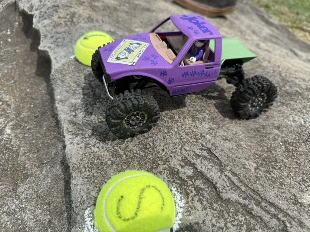 Purple micro crawler navigating the rock course
