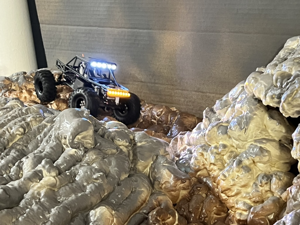 RC crawler navigating a rocky indoor course